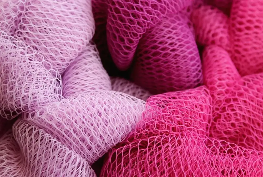Pink power-mesh fabric of the kind used in brief front panels