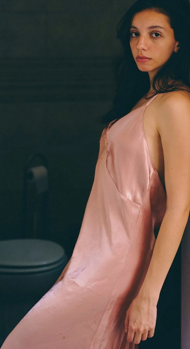 Rose-coloured satin slip worn by a model